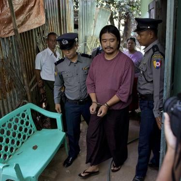Police officers escort humanitarian worker Patrick Khum Jaa Lee during a court hearing in Rangoon on January 22, 2016. He served six months in prison for allegedly posting an image deemed “insulting” to the military. 