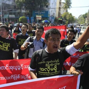 Reporters shout as they march to demonstrate for press freedom in Rangoon on January 7, 2014, after a journalist working for Eleven Media was sentenced to three months in prison on charges of defamation. 