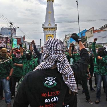 A group opposing the Lesbian, Gay, Bisexual and Transgender (LGBT) community prepares to confront a pro-LGBT group planning on staging a counter protest at Tugu Monument in Yogyakarta on Feb. 23. 
