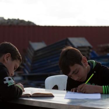 Wa’el, 13, and Fouad, 7, originally from Idlib, study outside their home in Jounieh. Their mother, Kawthar, 33, struggled to enroll them in school, and eventually withdrew them due to concerns about the quality of education and transportation costs of US$