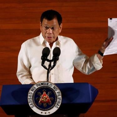 Philippine President Rodrigo Duterte holds up a copy of his speech as he speaks before the lawmakers during his first State of the Nation Address at the Philippine Congress in Quezon city, Metro Manila, Philippines July 25, 2016.