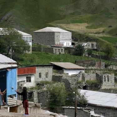 Two girls play ball in a mountain village of Dagestan in Russia's North Caucasus region, August 20, 2007.