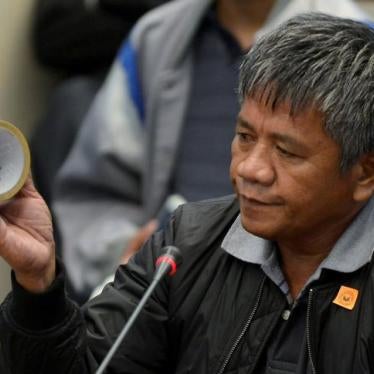 Edgar Matobato, a self-confessed former hitman, holds up a roll of tape, the type of which he claims he used on his victims, during a senate hearing on drug-related extra-judicial killings, in Pasay city, Metro Manila, Philippines, September 15, 2016. REU