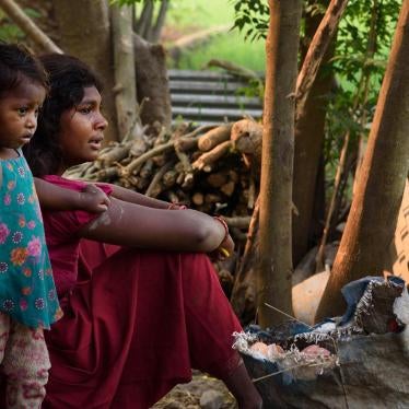 17-year-old Anjana M., married at 14, sits outside her home with her two-year-old daughter Ishita. Anjana’s aunt and uncle pressured her to marry her husband because of rumors about her relationship with him. Anjana’s father sent her to Pokhara when she w