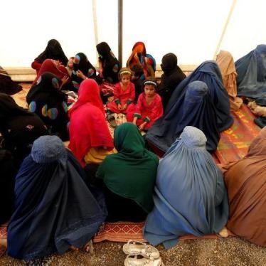 Afghan women sit with their children after arriving at a United Nations High Commissioner for Refugees (UNHCR) registration centre in Kabul, Afghanistan September 27, 2016.