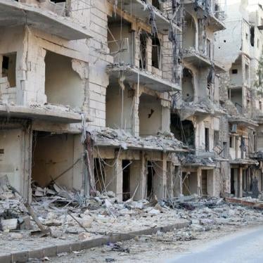 A man walks past damaged buildings in the rebel held besieged al-Sukkari neighbourhood of Aleppo, Syria October 19, 2016. 