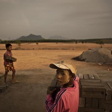 Children and adults making and stacking bricks on the construction site of the UMH Industrial Park special economic zone, north of the city of Hpa-an. Sand dug from the Salween River is used in the manufacture of the bricks. 