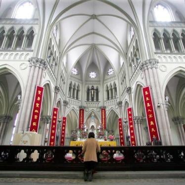 A Chinese Catholic prays on Easter Sunday at the state-sanctioned Saint Ignatius Cathedral in Shanghai.