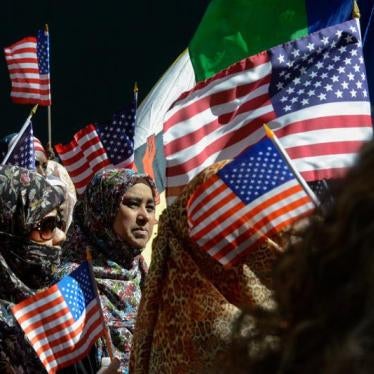 People participating in the annual Muslim Day Parade carry U.S. flags in the Manhattan borough of New York City, September 25, 2016. 