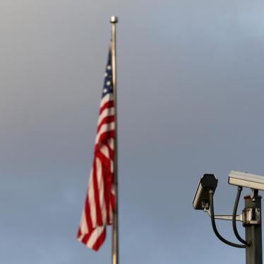 A surveillance camera is pictured in front of the U.S. flag, September 20, 2016.