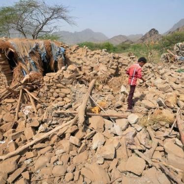 A boy walks on the rubble of houses destroyed by Saudi-led air strikes in Khamis Bani-Saad district of the western province of al-Mahweet, Yemen, October 27, 2016.