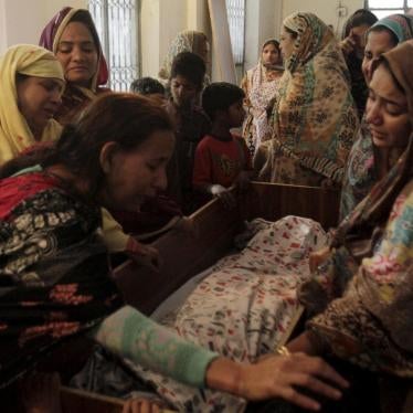 Family members mourn the death of a relative, who was killed in the public park bombing on Sunday, in Lahore on March 28, 2016. 
