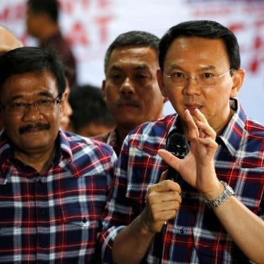Jakarta Governor Basuki Tjahaja Purnama, nicknamed "Ahok", (R) speaks with the media regarding a blasphemy complaint against him while standing next to deputy governor Djarot Saiful Hidayat in Jakarta, Indonesia November 16, 2016.