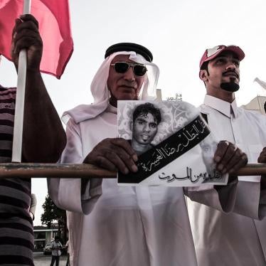 Demonstrators in Manama, Bahrain’s capital, hold placards of torture victims during a sit-in next to the United Nations building organized by the political opposition to mark the International Day in Support of Victims of Torture on June 26, 2014.   © 201