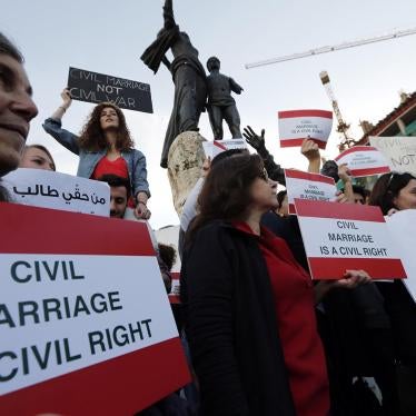 Activists hold placards during a protest demanding civil marriage in Lebanon, February 2013. There is currently no Lebanese civil personal status law. © 2013 Reuters/Jamal Saidi