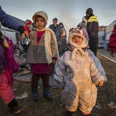 A group of children among hundreds of asylum seekers and migrants staying in freezing conditions at a gas station near the Greek border with Macedonia. January 29, 2016.