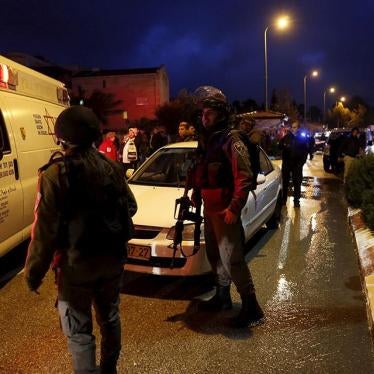 Israeli emergency personnel and security forces work at the scene of what Israeli police said was a stabbing attack by two Palestinians on two Israelis in the West Bank Jewish settlement of Beit Horon near Jerusalem on January 25, 2016.
