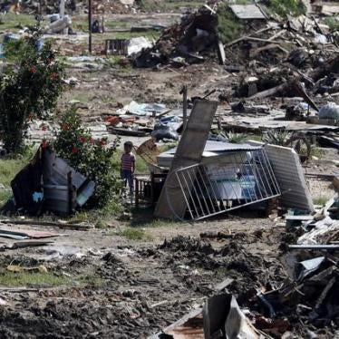 A child stands next to the ruins of houses, which were demolished by government officials during a special security operation called "Operation to Free the People" (OLP) in Valencia