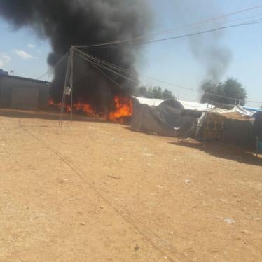 Shelters burning in Iqdah displaced persons camp near the closed Turkish border north of Aleppo after ISIS took over the camp on April 14. 