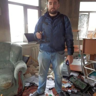 Sergei Babinets of the Joint Mobile Group for Human Rights Defenders in Chechnya surveys the damage done to JMG’s destroyed office. Grozny, Chechnya. 