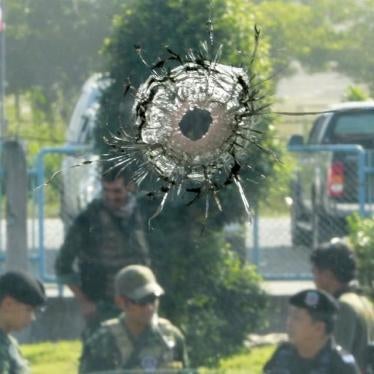 Military personnel inspect the site of an attack in Joh Airong, Narathiwat province, Thailand on March 14, 2016. 