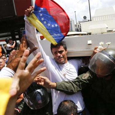 Venezuelan opposition leader Leopoldo Lopez gets into a National Guard armored vehicle