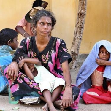 A family of internally displaced Sri Lankan Tamils wait in Kathankulam village in Mannar, Sri Lanka on October 22, 2009.