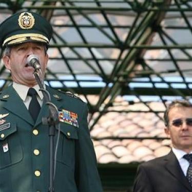 Colombia's then army commander Gen. Mario Montoya speaks as President Alvaro Uribe looks on at Bogota's army school on February 22, 2006.