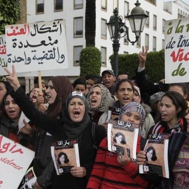 Women from various regions of Morocco hold placards as they protest against violence towards women, in Rabat November 24, 2013. The placard reads, "In memory of all women victims of violence". 