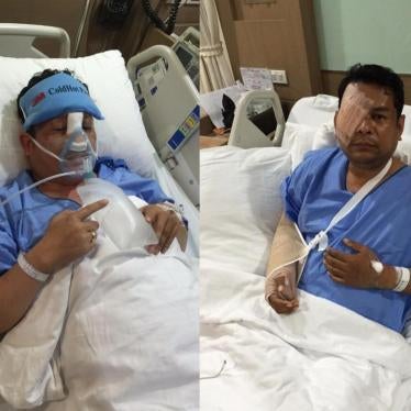 Cambodia National Rescue Party assembly members Kung Sophea and Nhay Chamraoen at a Bangkok hospital after the October 26, 2015 attack outside the Cambodian National Assembly in Phnom Penh. October 29, 2015. © 2015 Human Rights Watch