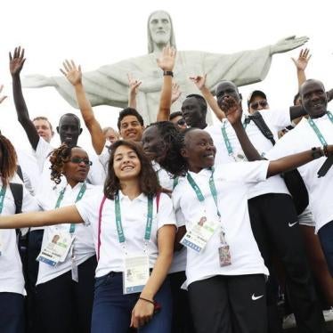 Members of the 2016 Olympic refugee team pose in front of Christ the Redeemer in advance of the Olympic games in Rio De Janeiro, Brazil on July 30, 2016.
