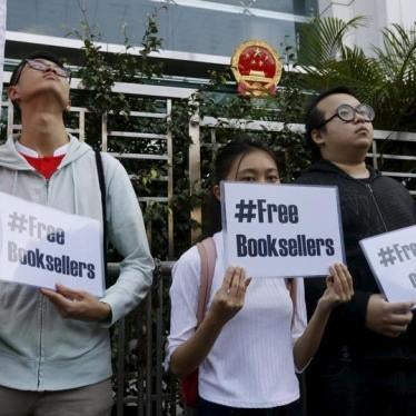 Members of student group Scholarism hold up placards during a protest about the disappearances of booksellers outside China's liaison office in Hong Kong, China January 6, 2016.