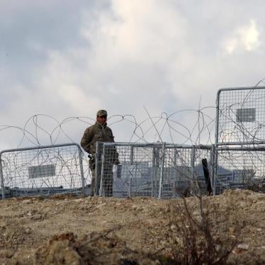 A border guard manning Turkey’s closed border with Syria patrols near the Turkish village of Guvecci, February 7, 2016. 