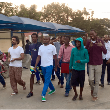 Book-club activists walk through the streets of Luanda after their provisional release.