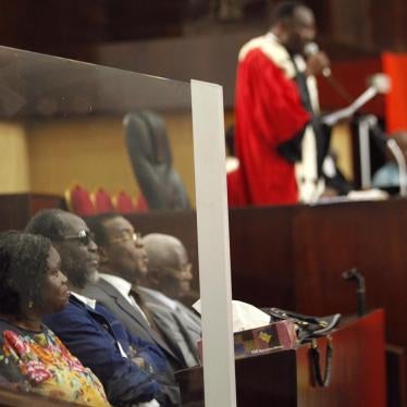 Ivory Coast's former first lady Simone Gbagbo (at left) on December 26, 2014 during the first day of her previous trial for crimes against the state.