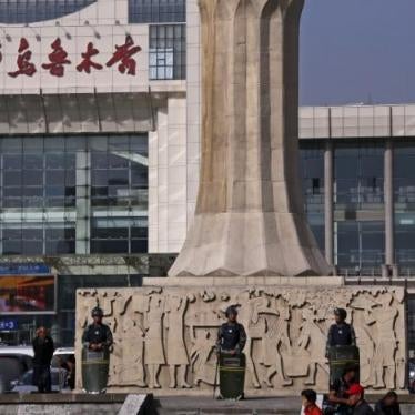 Police stand outside the South Railway Station in Urumqi, Xinjiang Uighur Autonomous Region on May 2, 2014. 