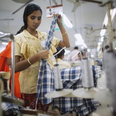 An employee works in a factory of Babylon Garments in Dhaka January 3, 2014.