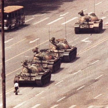 A man stands in front of a convoy of tanks in the Avenue of Eternal Peace in Tiananmen Square in Beijing in this June 5, 1989 file photo.