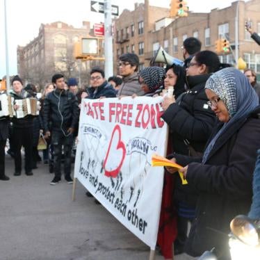 People gather for a press conference and march to launch a community defense and “Hate-Free Zone” in Brooklyn, New York, January 25, 2017. Kazi Fouzia, a community organizer at DRUM, reading a handout at a rally organized by DRUM in Brooklyn