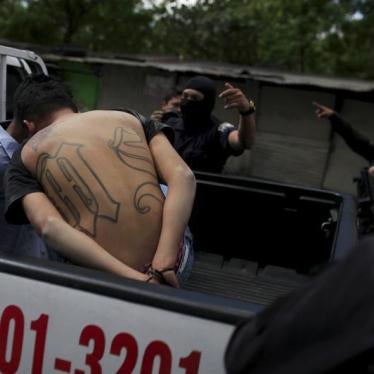 Members of the MS-13 gang are detained near the crime scene where two men, Jose Wilfredo Navidad and Nestor Alexander Rivera, were killed as they rode a motorcycle on their way to work, in San Salvador, El Salvador January 26, 2016.