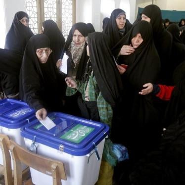 Women cast their ballots at a polling station in the city of Qom,120 km (75 miles) south of Tehran, December 15, 2006.