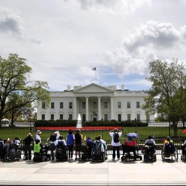 Protesters with ADAPT, a disabled people's rights organization, stage a demonstration at the gates of the White House in Washington, April 20, 2015.