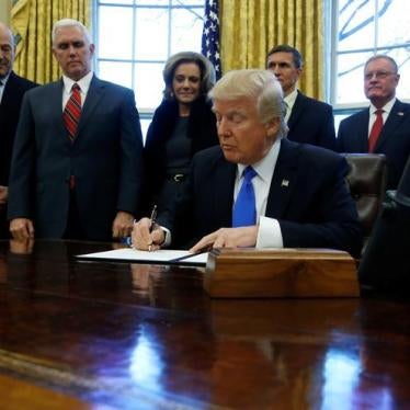 U.S. President Donald Trump signs a memorandum to security services directing them to defeat the Islamic State in the Oval Office at the White House in Washington, U.S. January 28, 2017.