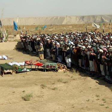 Afghans attend a funeral for those killed by an airstrike during a raid on suspected Taliban forces in Kunduz on November 4, 2016.