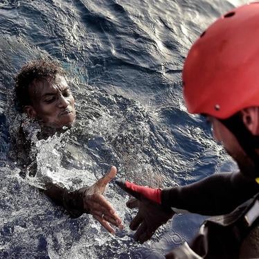 A migrant is rescued from the mediteranean sea by a member of Proactiva Open Arms NGO some 20 nautical miles north of Libya on October 3, 2016. 