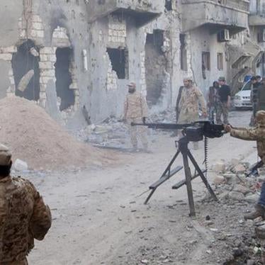 Members of the Libyan National Army, the armed forces allied with the Interim Government in al-Bayda, during clashes with the Benghazi Revolutionaries Shura Council, an Islamist militia alliance, in Benghazi on April 1, 2015. 