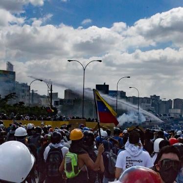 Venezuelan security forces use a water cannon to disperse an anti-government demonstration on the Francisco Fajardo Highway.