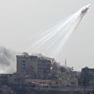 Photo of smoking and burning white phosphorus streaking to the ground in west Mosul on June 2, 2017. 