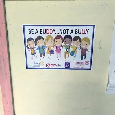 A poster for an anti-bullying campaign hangs on a wall at a secondary school outside Cebu, November 2016. 