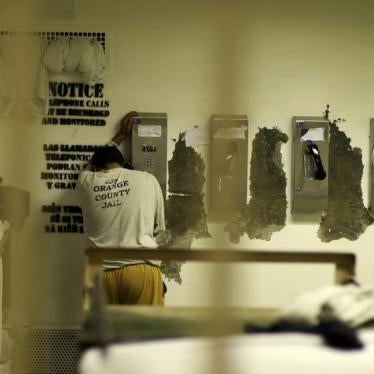 An inmate makes a phone call from his cell at the Orange County jail in Santa Ana, California, May 24, 2011.